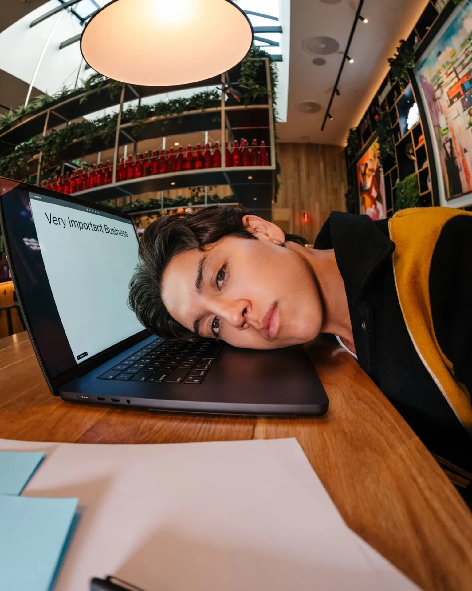 coworking shoot - face on laptop
