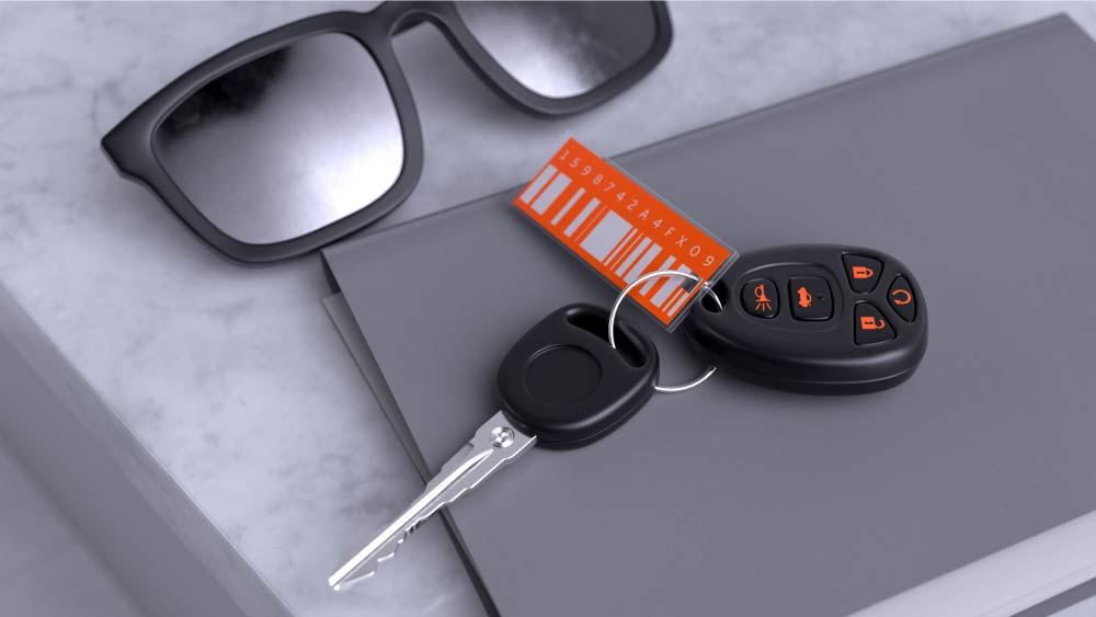 Rental car keys and paperwork on a countertop