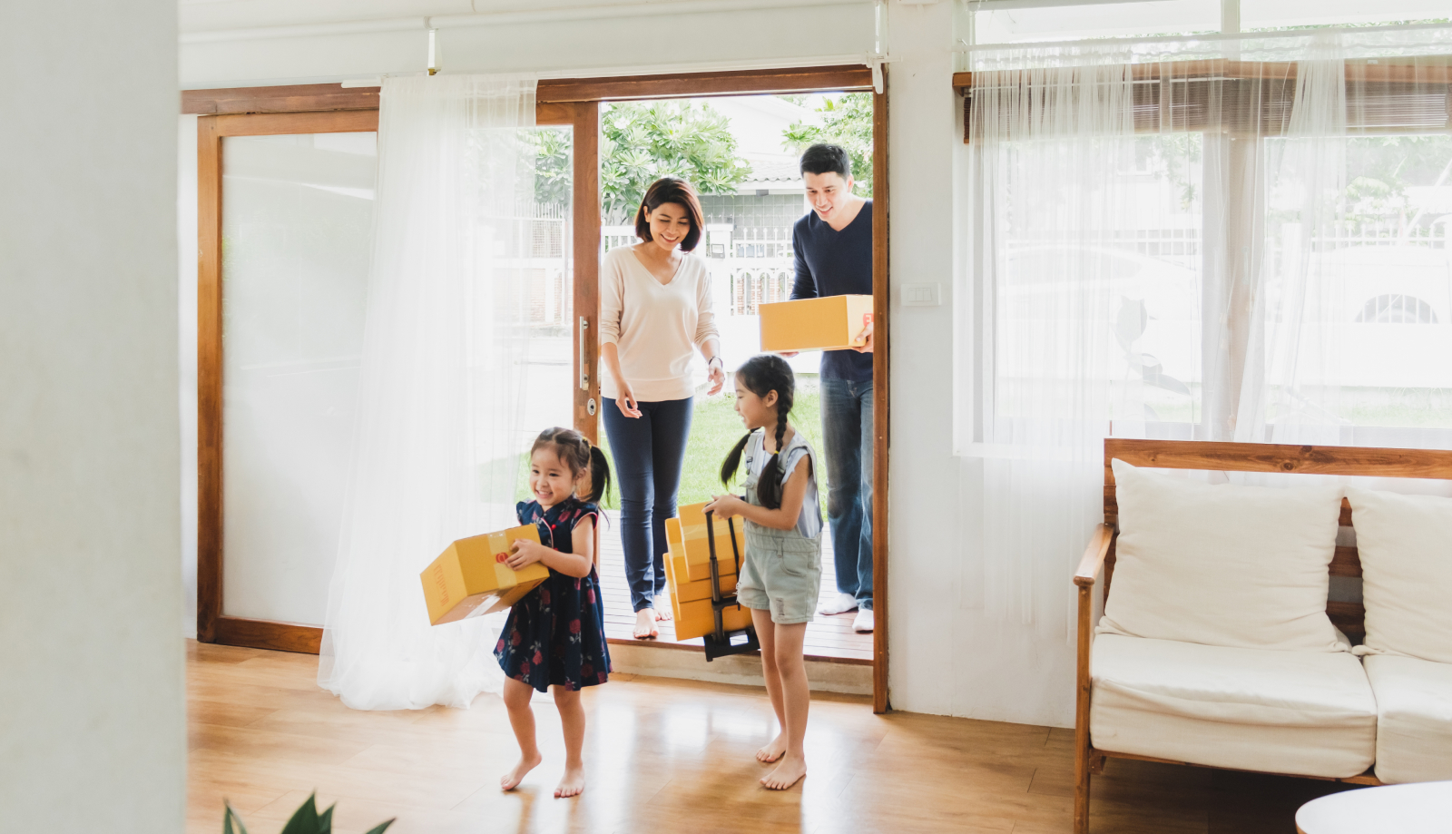 Happy family moving into their new house