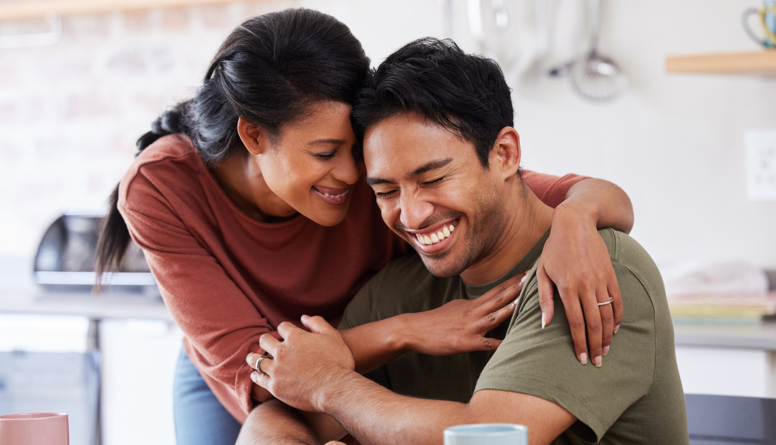 Couple hugging in the kitchen