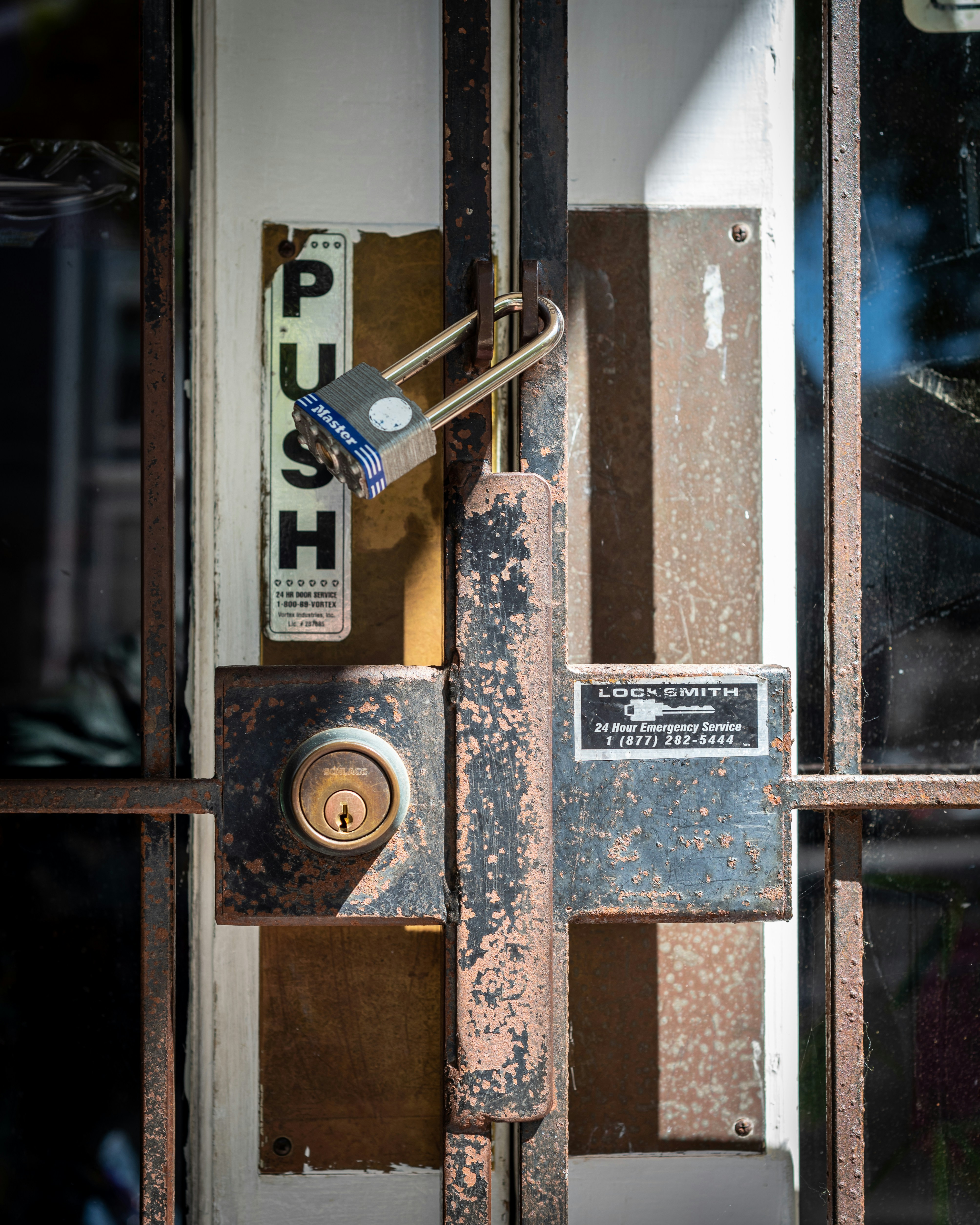A customer entrance blocked by an impassable locked gate
