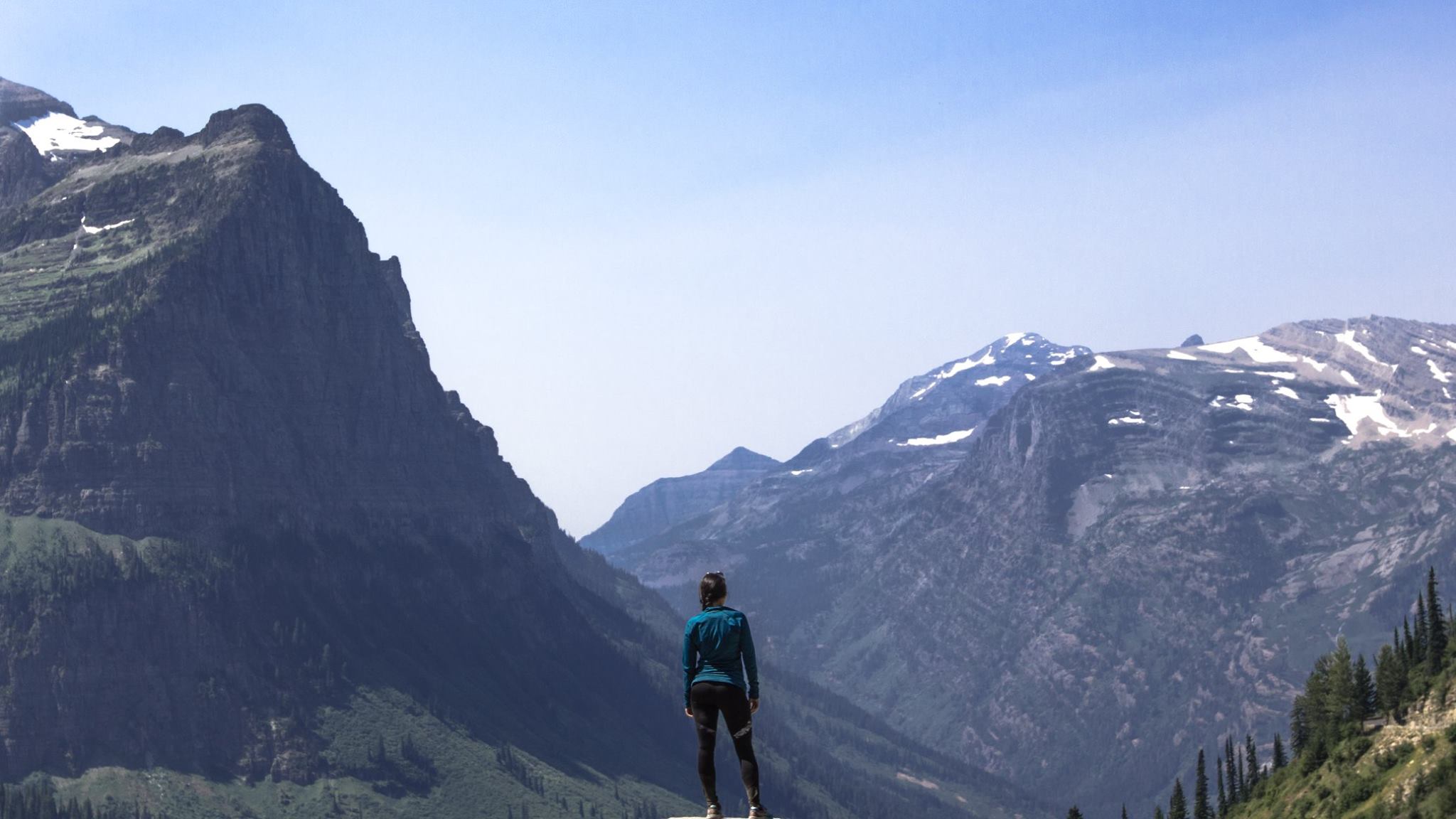 A hiker looks over a gorge