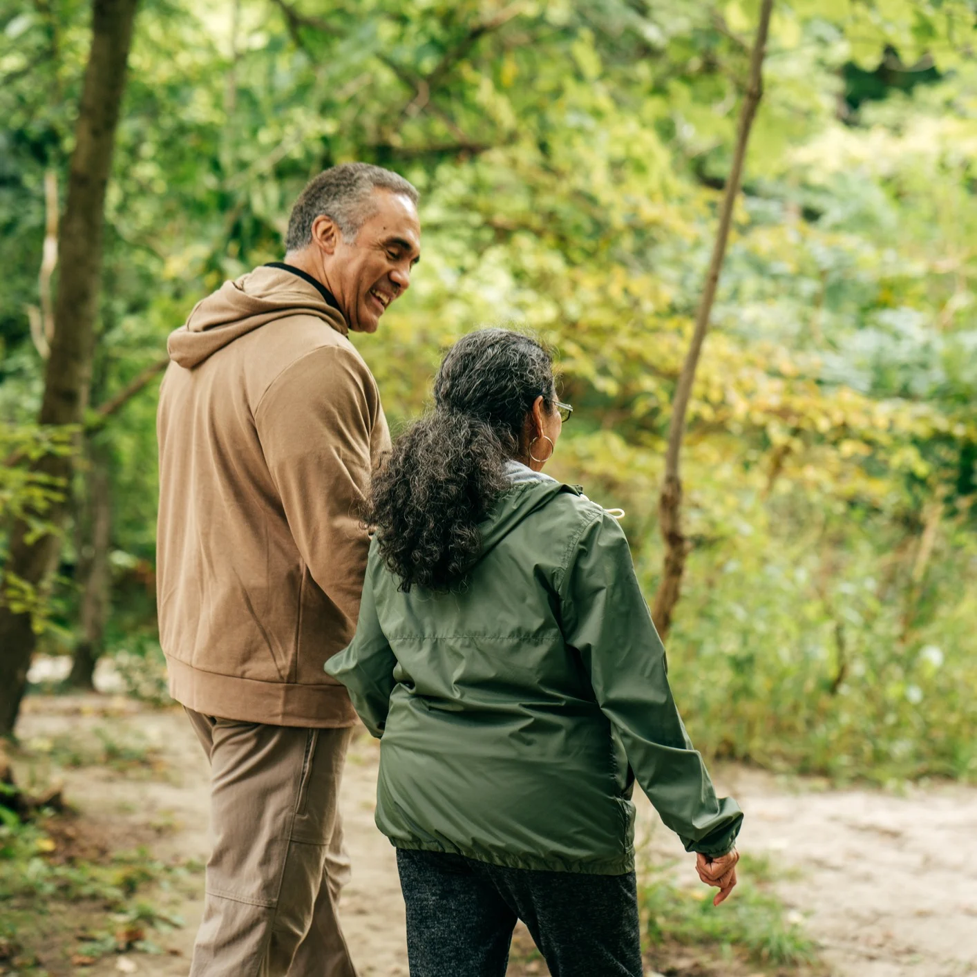 Image - Hispanic couple walking through forest