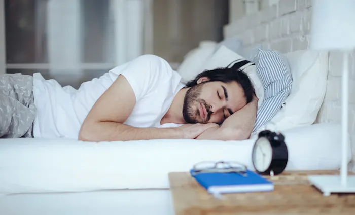 Man sleeping in bed