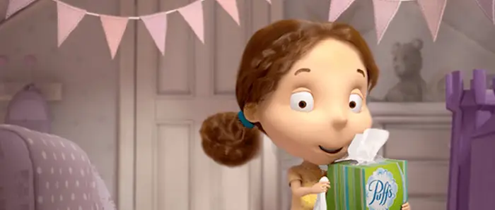 Puffs Pal Dakota in bedroom holding a box of Puffs Plus Lotion from 2010s
