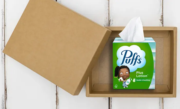 Puffs Plus Lotion in a care package box