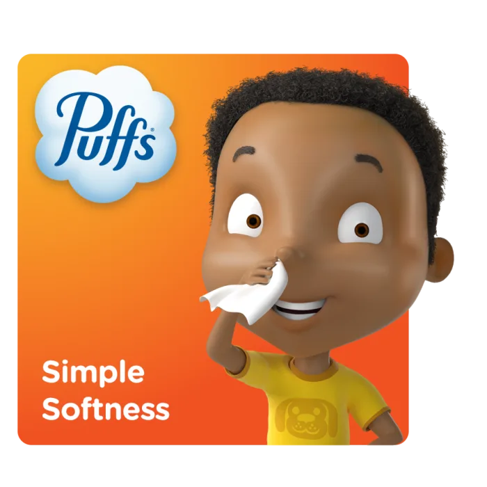Puffs Pal Theo smiling and holding a Puffs tissue to his nose