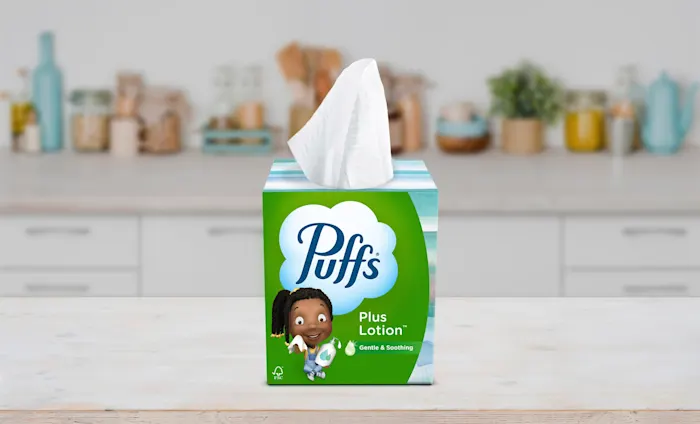 Puffs Plus Lotion box on a counter
