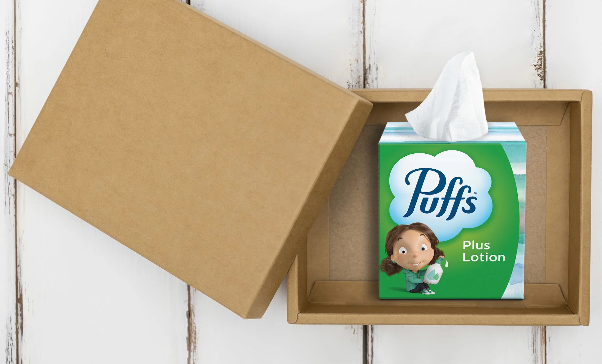 Puffs Plus Lotion box of tissues sitting on the table