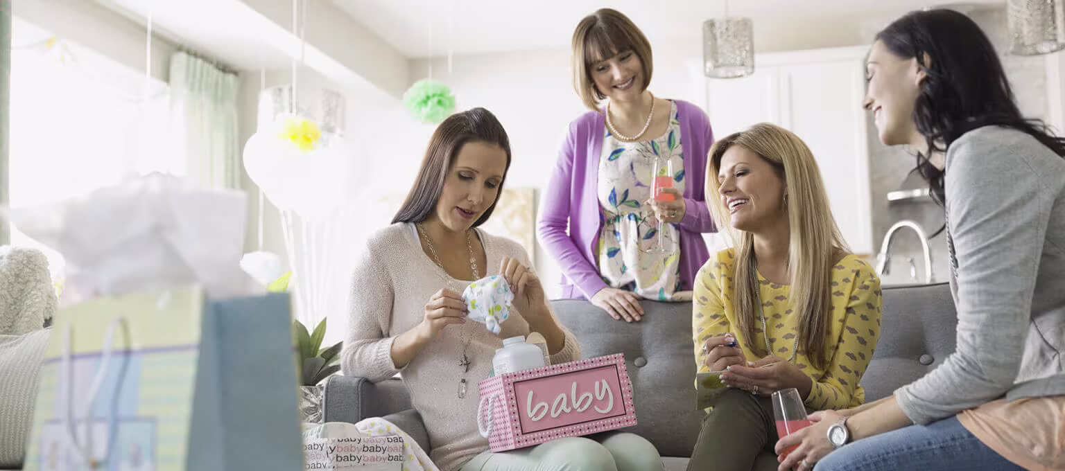 Baby shower: mom-to-be and guests having fun