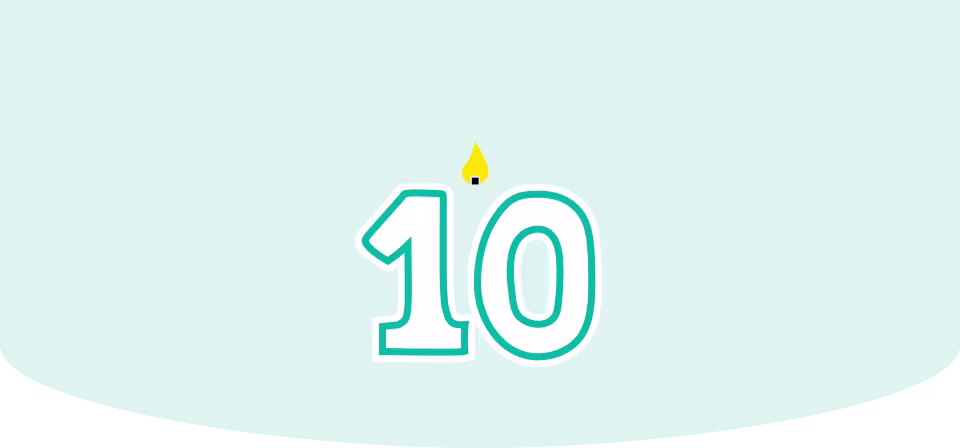 Number 10 birthday candle with a lit flame