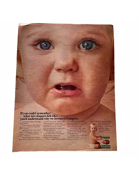 Newspaper page with a picture of a sad baby