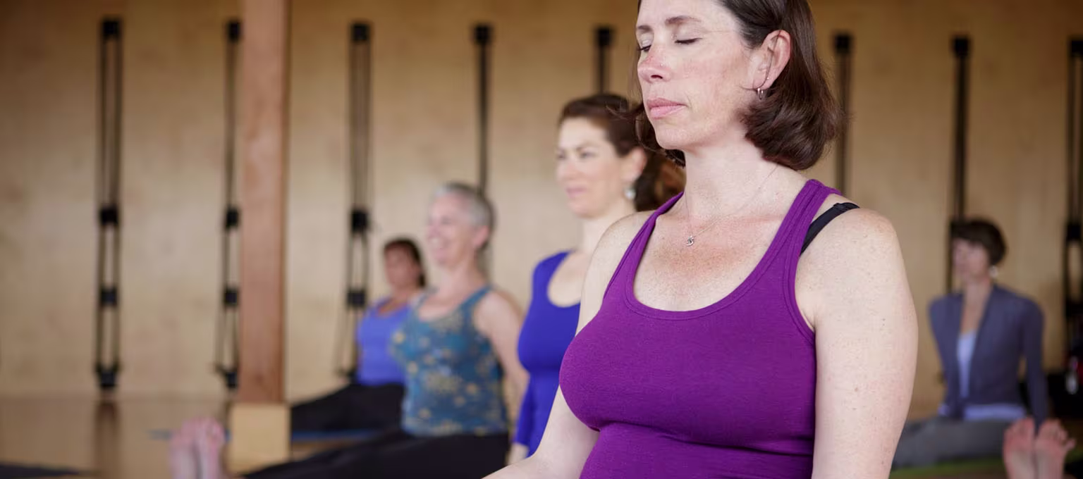 Pregnant woman practicing prenatal yoga