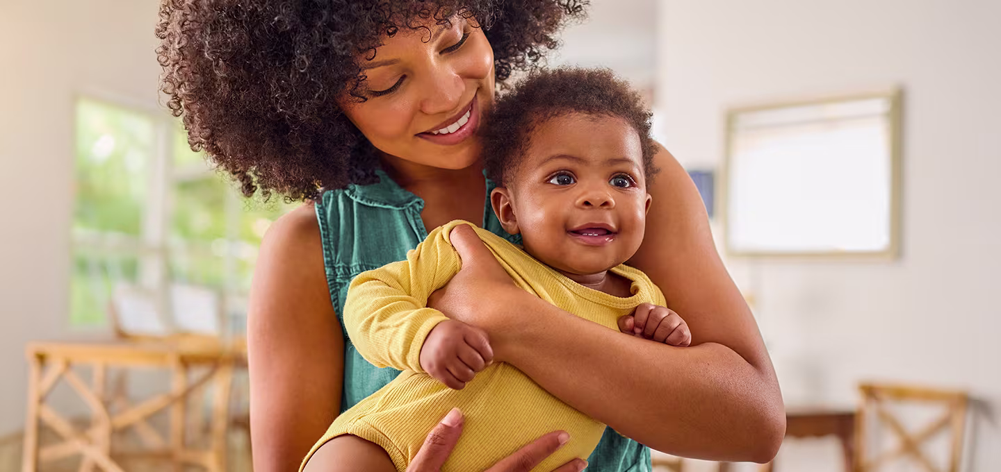 Mom holding her baby in her arm