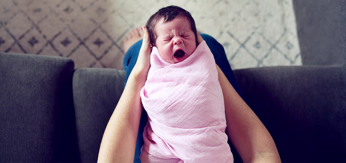 When to stop swaddling baby