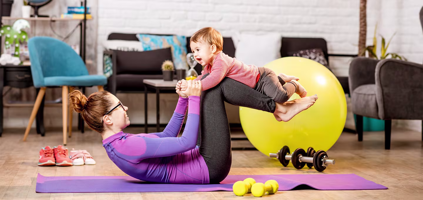 A woman exercising with her baby