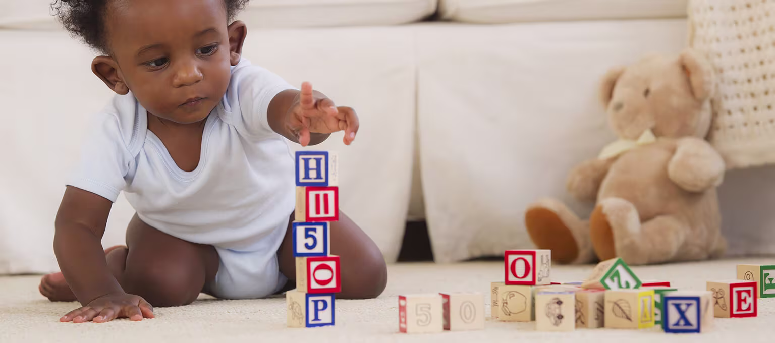 Baby playing with cubes