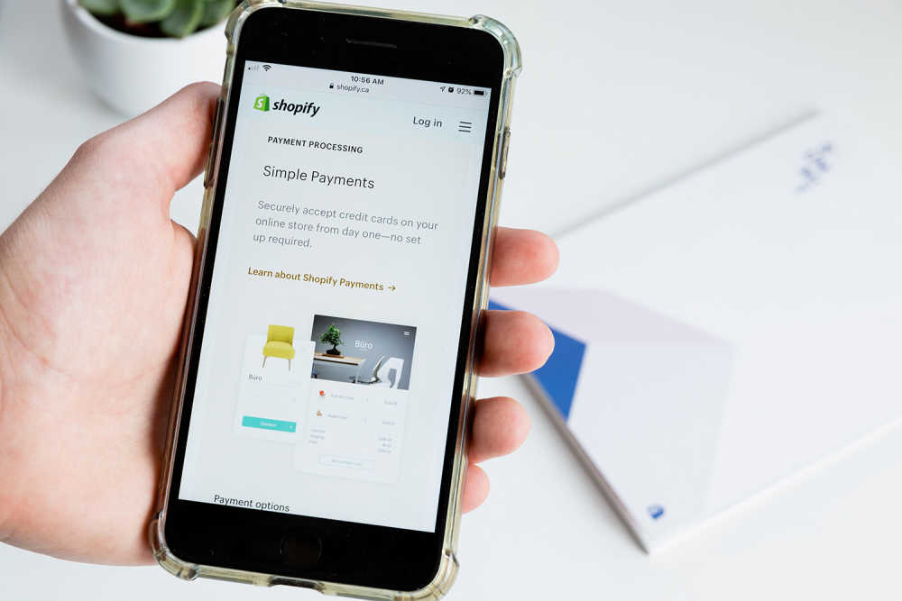a mobile device displaying an email from Shopify about 