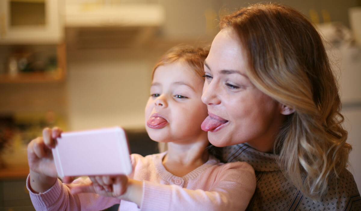 Mom and daughter taking selfie