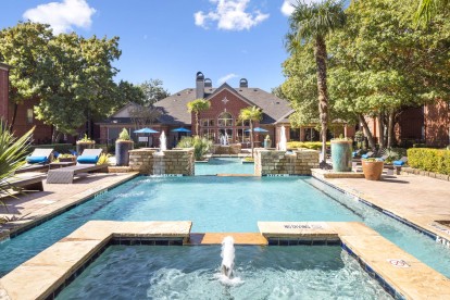 Pool with water feature and sundeck