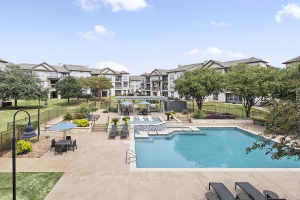 Resort-style pool and spacious sundeck at Camden Cedar Hills apartments in Austin, TX