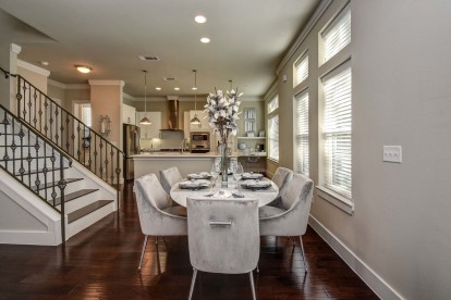 The townhomes dining room alongside staircase to upper floors