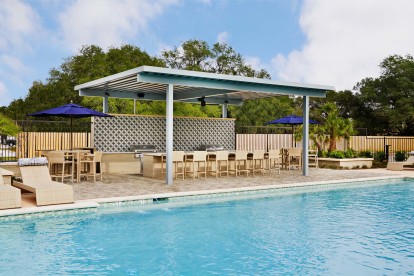 Resort-Style Pool with Covered Grilling and Bar Area