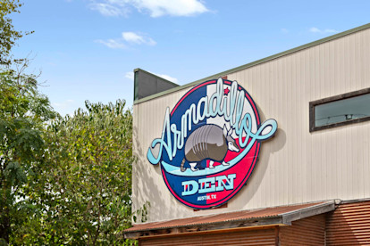 Armadillo Den building sign near Camden Shadow Brook apartments in Austin, TX