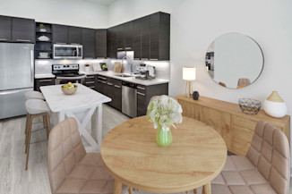 Dining area and kitchen at Camden Shady Grove apartments in Rockville, MD