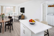 White contemporary open-concept living area at Camden Grandview in Charlotte, NC