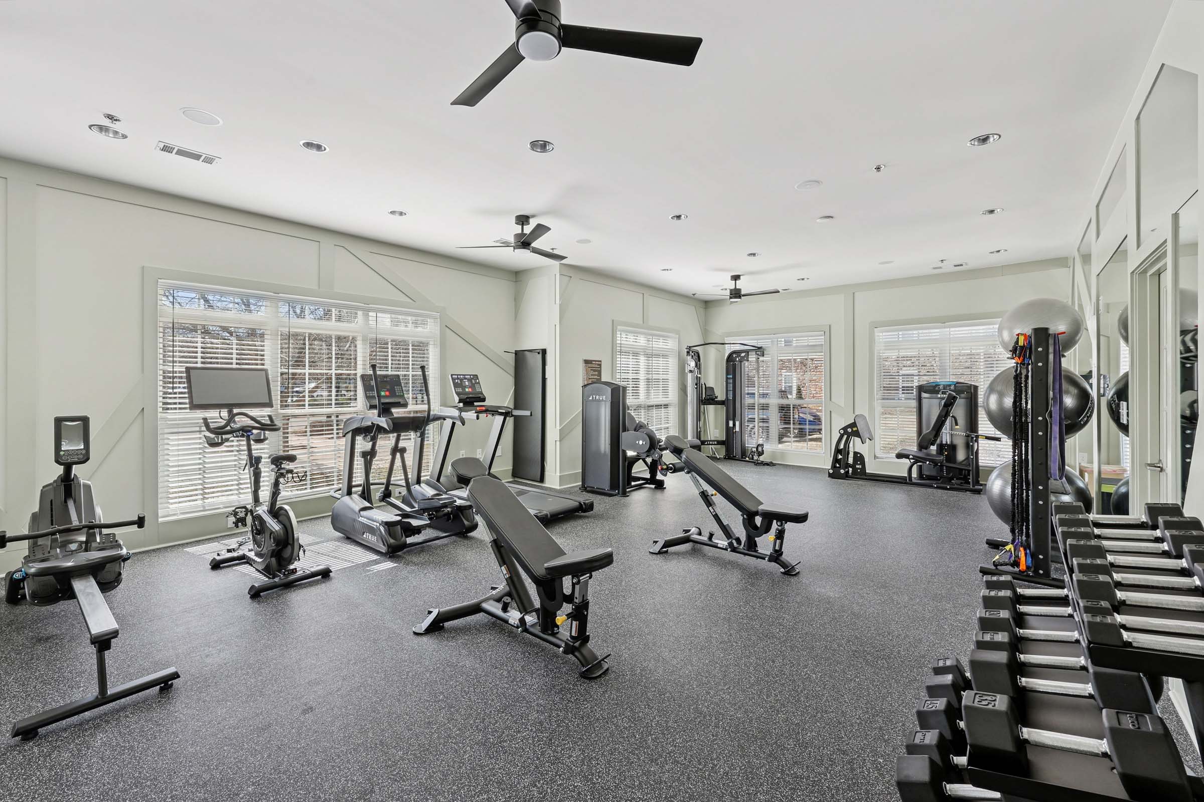 Fitness center with spin bike, free weights and row machine at Camden Franklin apartments in Franklin, TN