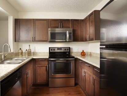 Kitchen with energy efficient stainless steel appliances including microwave