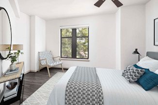 Bedroom with ceiling fan at Camden Potomac Yard Apartments in Arlington, VA
