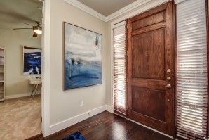 The townhomes entrance with wood flooring and den