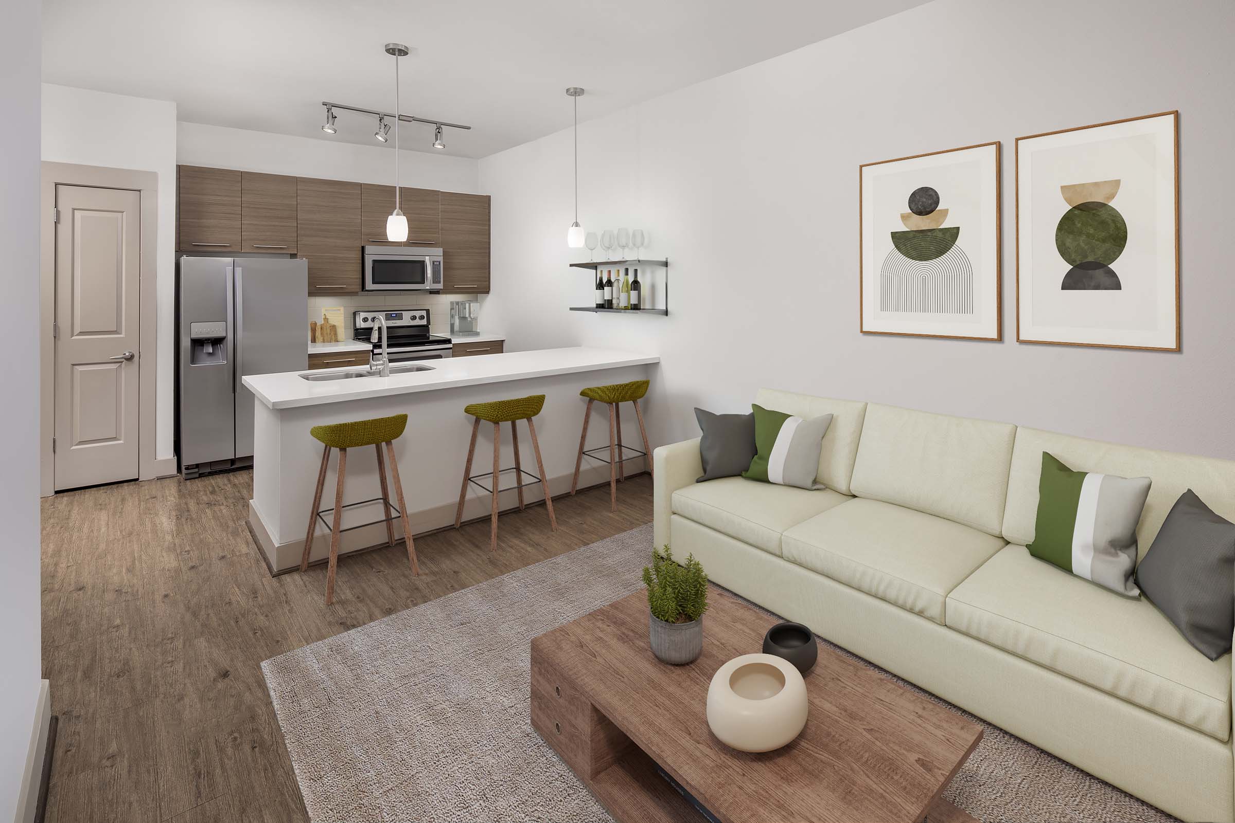 Open-concept living room with wood-style flooring at Camden Lamar Heights