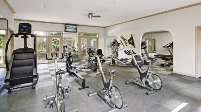 Fitness center with cardio equipment at Camden Midtown Apartments in Houston, TX
