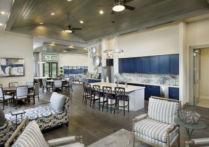Resident lounge with demonstration kitchen and seating area