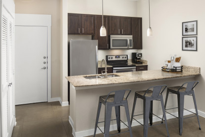 Loft-style kitchen at Camden Farmers Market Apartments in Dallas, TX