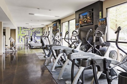 24 hour fitness center with treadmills elliptical machines and stationary bikes