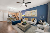 Living room and kitchen at Camden Lake Buena Vista apartments in Orlando, FL.