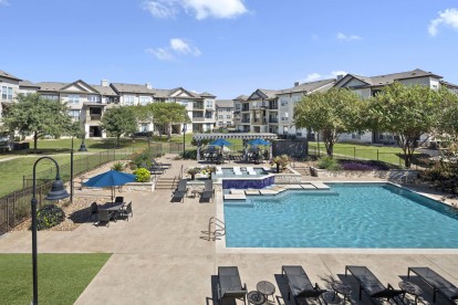 Resort-style pool and sundeck at Camden Cedar Hills apartments in Austin, TX