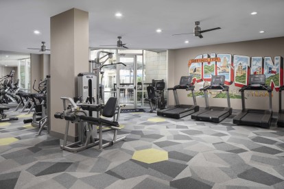 24-hour fitness center with Austin mural at Camden Lamar Heights apartments in Austin, TX