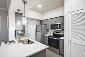 Kitchen with Quartz Countertops and Stainless Steel Appliances