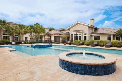 Resort style pool with water feature