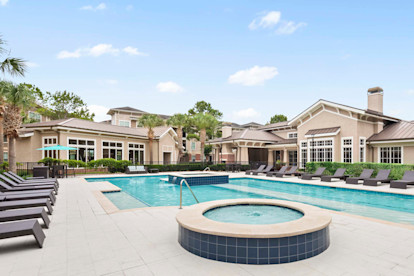 Resort style pool with water feature at Camden Grand Harbor Apartments in Katy, Tx