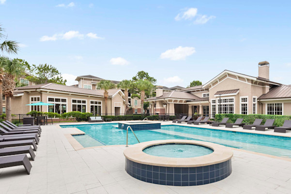 Resort style pool with water feature at Camden Grand Harbor Apartments in Katy, Tx