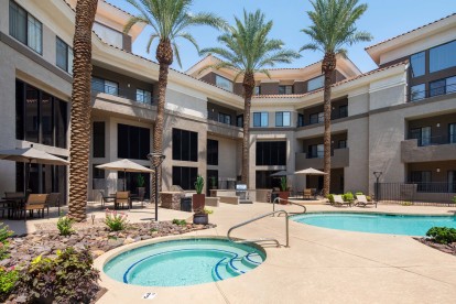 Swimming pool and spa near grilling stations and dining areas