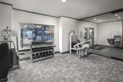 Fitness center entry with free weights and bottle filling station