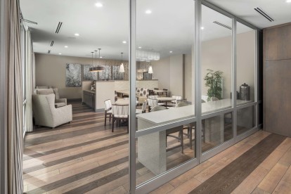 Resident clubroom with glass room divider walls at Camden Lamar Heights 