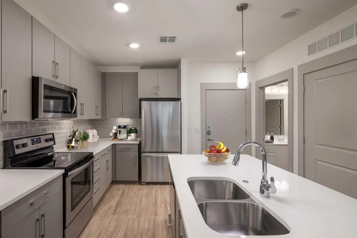 Furnished kitchen and island at Camden North End.